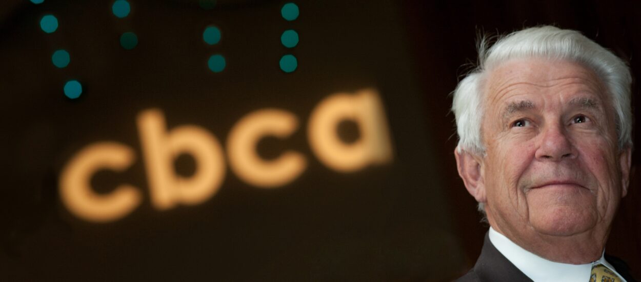 Image of CBCA's Founder John Madden, Jr. with CBCA logo in the background