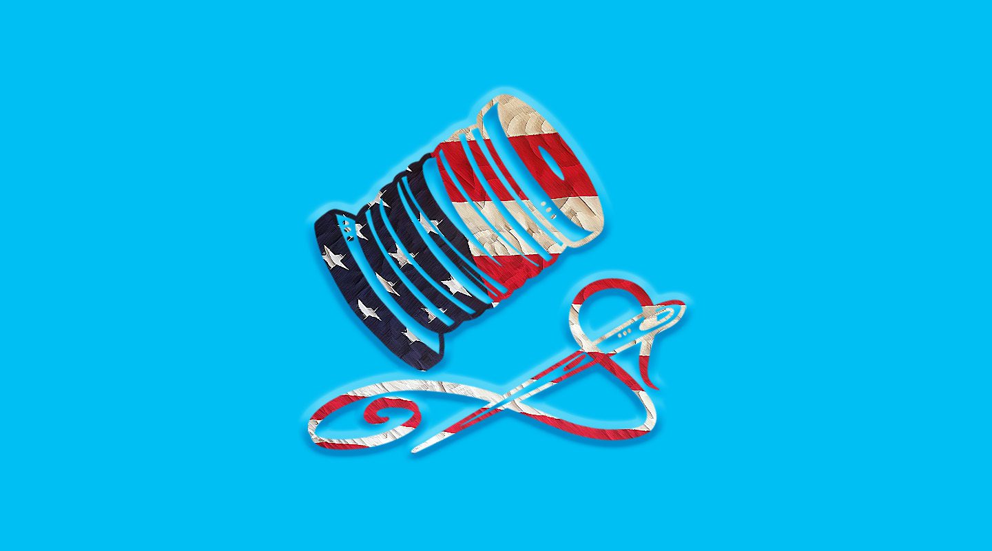 A spool of thread and needle with thread, both patterned in the style of the American flag, on a bright blue background.